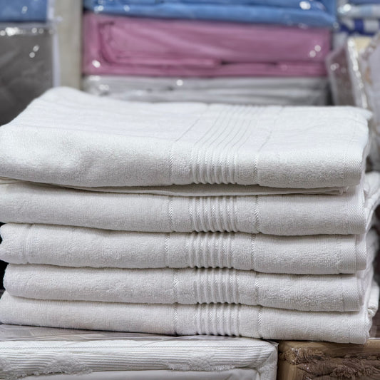 Stack of white towels in a store setting